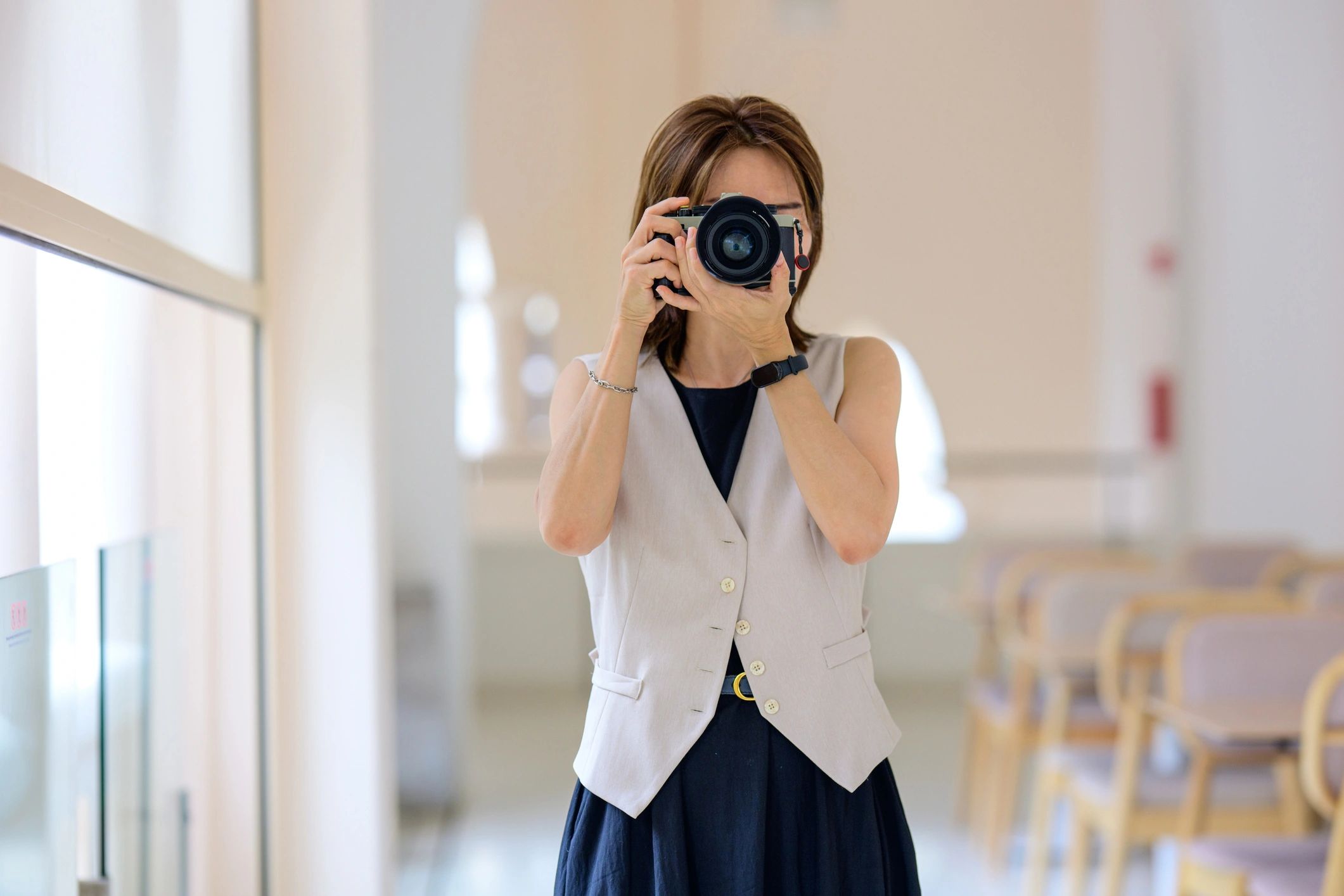 Photographer working in a bright interior space